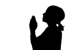 silhouette-girl-praying-bowed-prayer-43491343.jpg