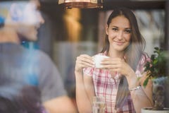 http://thumbs.dreamstime.com/t/young-couple-first-date-drinking-coffee-shot-window-44885974.jpg