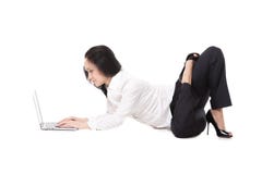 Young office woman lying in yoga pose with laptop, on white back ...