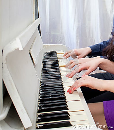 Сlose up view of hands playing piano