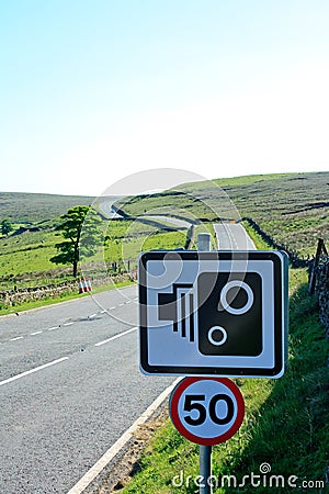 50mph speed camera sign with fast moorland road in