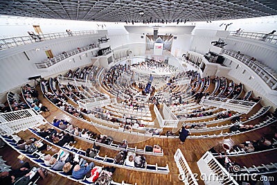 Above view of people sit down on seats