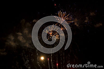 Abstract Background: Rising and Exploding Orange and Purple Fireworks with Smoke