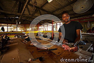 ACCRA, GHANA � MARCH 18: Unidentified Ghanaian butcher doing hi