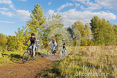 Active family on bikes cycling outdoors
