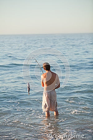 Active man fishing in the sea