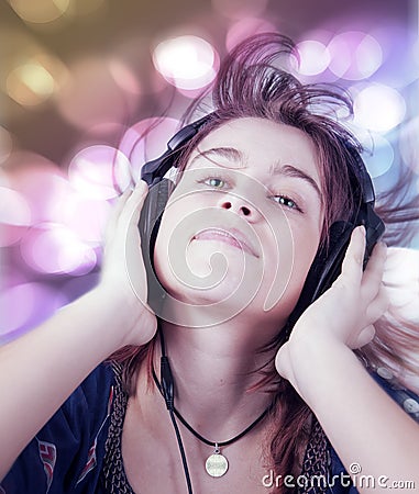 Active young teen woman listening dance music