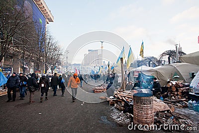 Activists walk around the barricades and a camp on the main square of capital during anti-government protest Euromaidan in Kiev