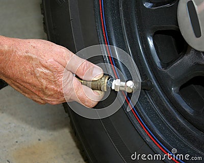 Adding air to an automobile tire