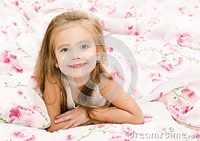 Adorable smiling little girl waked up