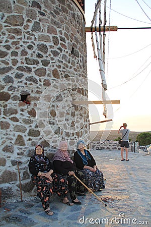 Aegean area - wind mill looking to aegean see sunset