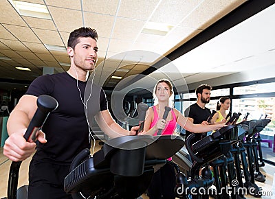 Aerobics elliptical walker trainer group at gym