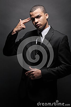 African-American business man in black suit.