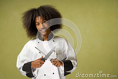 African American Chef Holding Knife and Sharpener