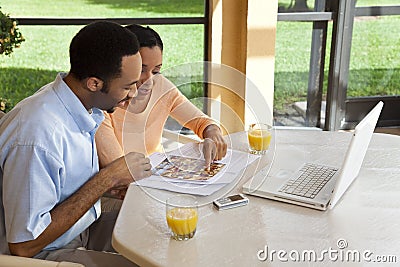 African American Couple Using Laptop Computer