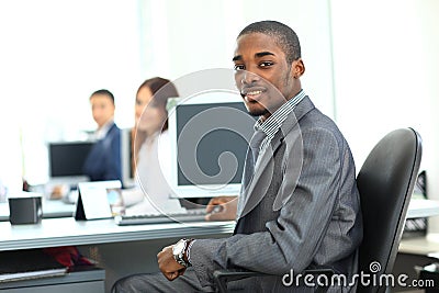 African American entrepreneur displaying computer laptop in office