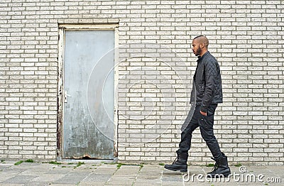 African american fashion model walking in urban environment