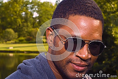 African American male in nature with sunglasses