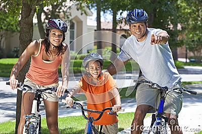 African American Parents WIth Boy Son Riding Bike