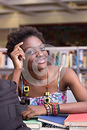 African American Student at the Library studying