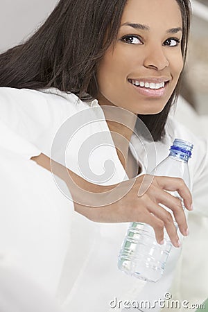 African American Woman Drinking Bottle of Water