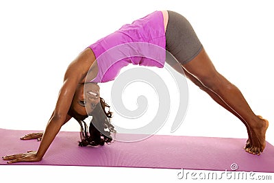 African American woman fitness down dog smile