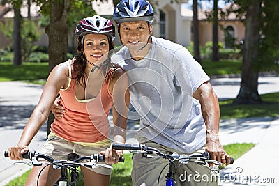 African American Woman & Man Couple Riding Bikes