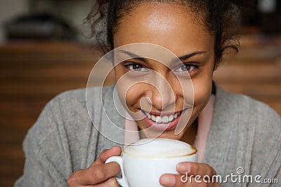 http://thumbs.dreamstime.com/x/african-american-woman-smiling-cup-coffee-close-up-portrait-beautiful-47015828.jpg