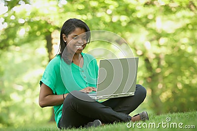 African American young woman using laptop computer