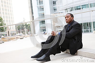 African Business Man Sitting at Office Building