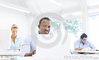 An African Businessman Working with His Laptop