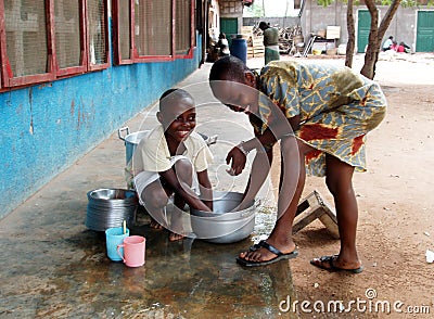 African children washing pots