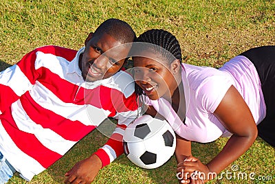 African couple with soccer ball