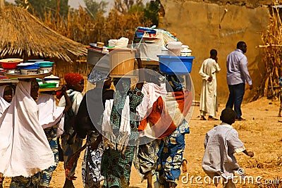 Africans Carrying Goods