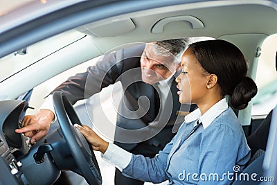 African woman buying car