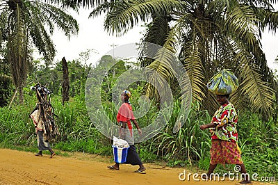 African women carrying food and wood