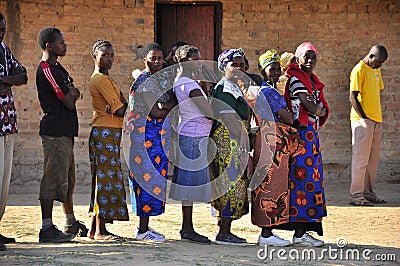 African women queuing to vote at polling station