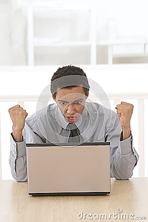 Afro Man shouting at his laptop