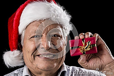 Aged Gentleman with Red Cap Holding Small Gift