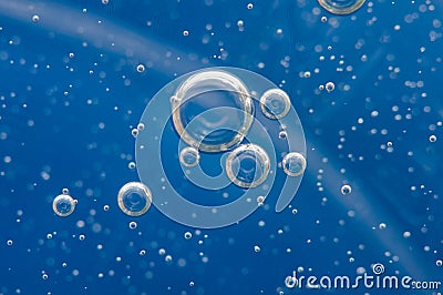 Air bubbles in a liquid. Abstract blue background