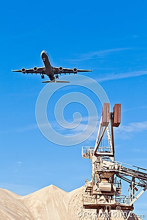 Aircraft in landing approach with blue sky