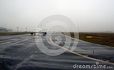 Aircraft landing on foggy runway