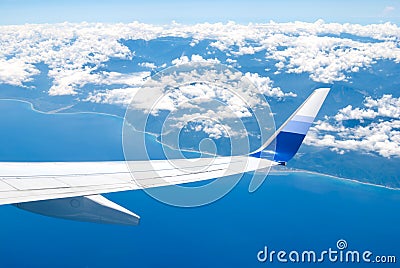 Airplane fly over land and ocean