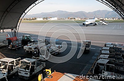 Airplane on runway and hangar