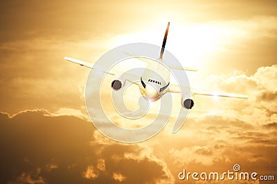 Airplane on sunset sky