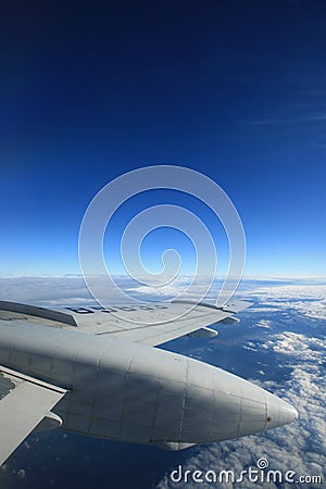 Airplane wing and blue sky