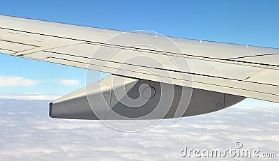 Airplane wing with fuel tanks over the clouds