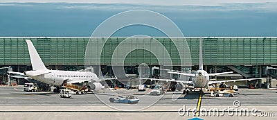 Airplanes on busy airport. Panorama