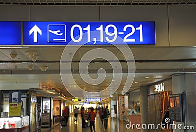Airport signs with gate numbers to boarding
