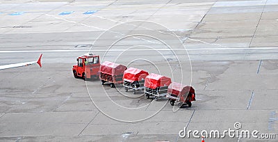 Airport trucks handling baggage